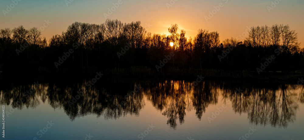 Beautiful sunset with reflections near Niederpöring, Isar, Bavaria, Germany