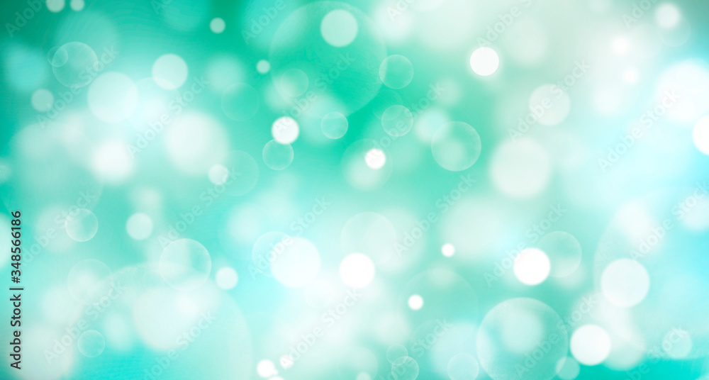 Abstract spring background, blurred bokeh circles, blue and green background, Christmas, bright, white bokeh spots, holiday