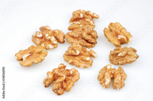 Useful organic walnuts, close-up, isolated on white background.