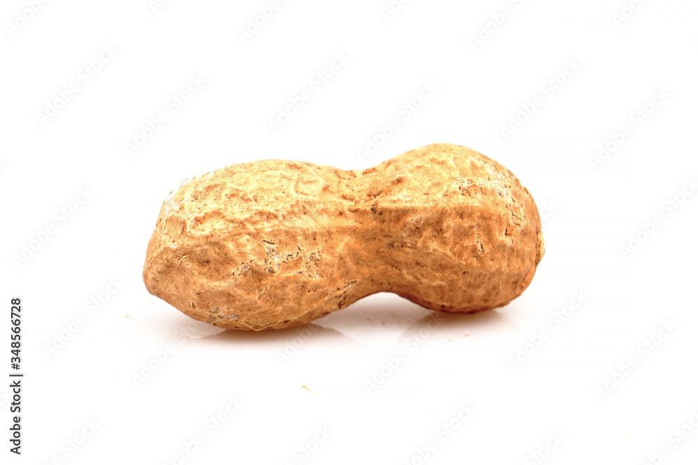 Organic Peanuts. A Unpeeled nuts isolated on white background