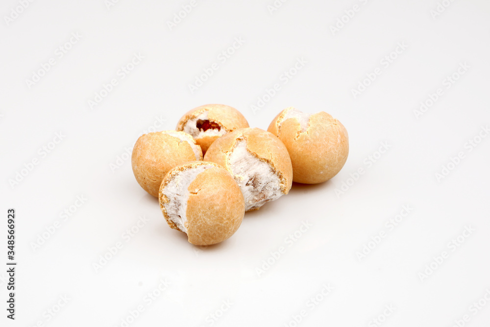 Salted peanuts with a little sauce on white ground Salted peanuts with a little sauce on white ground