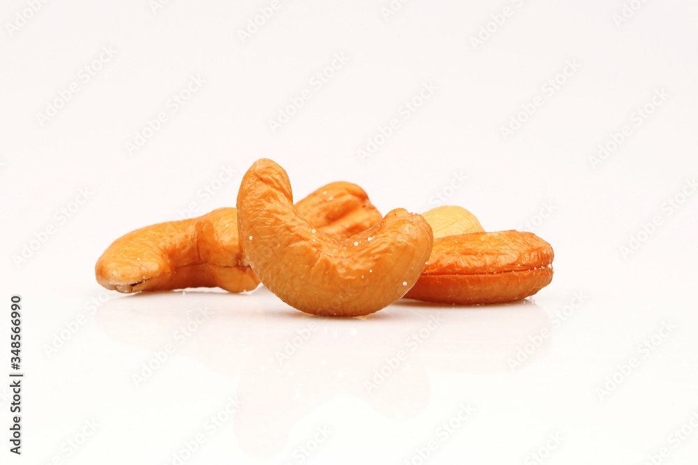Roasted salted organic cashews isolated on a white background Roasted salted organic cashews isolated on a white background