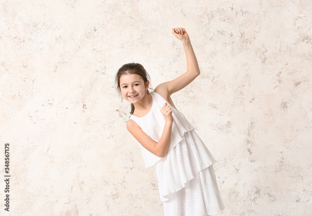 Cute dancing girl on light background Cute dancing girl on light background