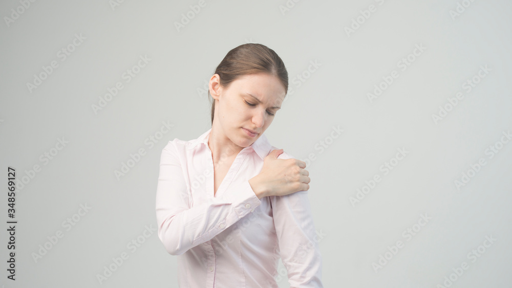 Tired woman feeling pain, massaging tense muscles Tired woman feeling pain, massaging tense muscles