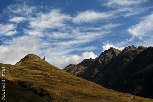 Medieval tower against a mountain landscape in Tusheti region