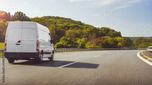 Obraz na plátně fast vans traveling on the highway