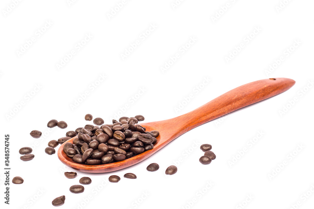 Fototapeta premium coffee beans in wooden spoon