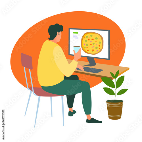 A man orders a pizza online from a computer during the quarantine