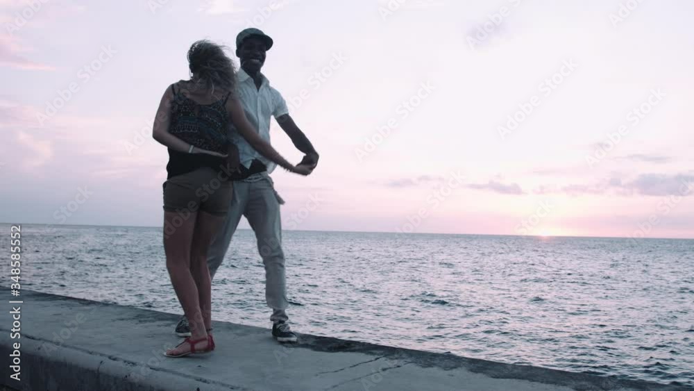 Looping video of Latin Couple salsa dancing at sunset with animation 4K dancer.