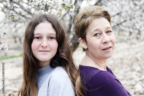 Portrait of beautiful woman and her teenager daughter