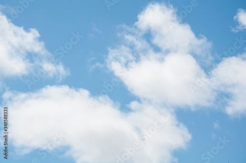 White cumulus clouds in sky in nature image great for backgrounds and texture.  This cloudscape beautiful for weather, heaven and meteorology.