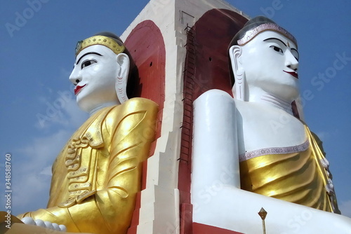 four faced directions golden buddha statue in myanmar in bago city
 photo