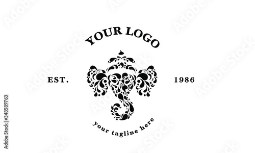 Indian ornamental elephant logotype. Floral animal logo. Label design for kids art school. Mandala doodle sign for tea or tea room