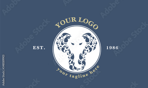 Indian ornamental elephant logotype. Floral animal logo. Label design for kids art school. Mandala doodle sign for tea or tea room