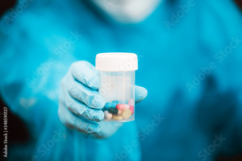 doctor holding pills