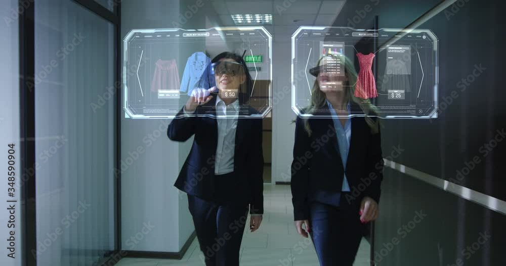 Women walking and using holographic technology