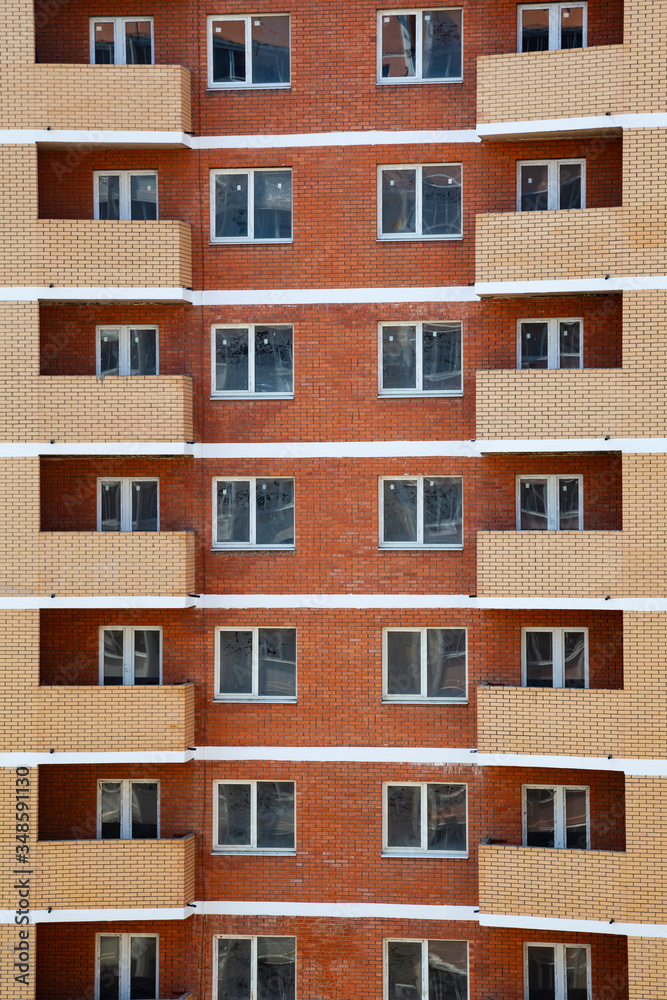 Fototapeta premium Unfinished high-rise apartment building.