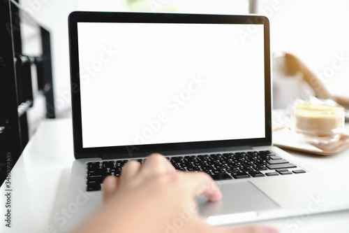 hand holding a laptop