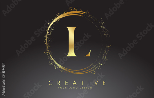 L golden letter logo with golden sparkling rings and dust glitter on a black background. Luxury decorative shiny vector illustration. photo