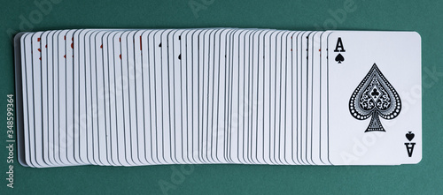 Cuadro en lienzo A deck of playing cards laid out on a green table