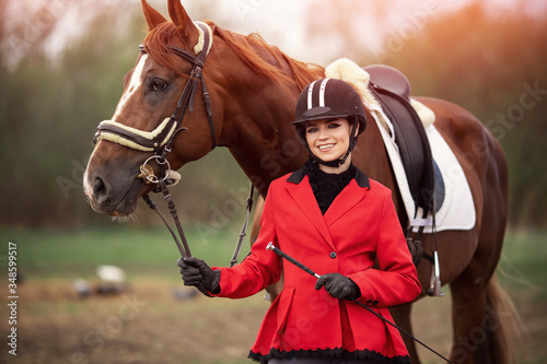 Portrait Jockey woman rider with brown horse, concept advertising equestrian club school © Parilov