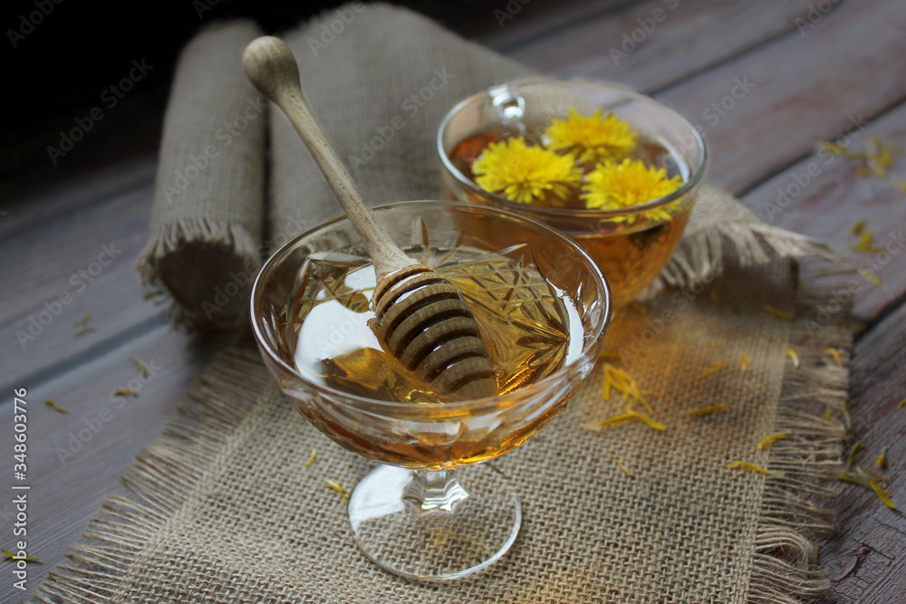 Cup of healthy dandelion tea and honey. Herbal medicine. Cup of healthy dandelion tea and honey. Herbal medicine.