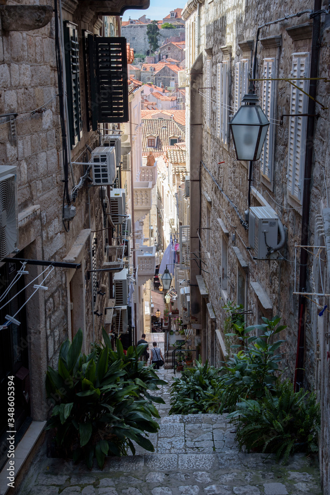 Fototapeta premium Narrow and steep street in Dubrovnik, formerly Ragusa, city located on the Dalmatian coast, Croatia, Europe