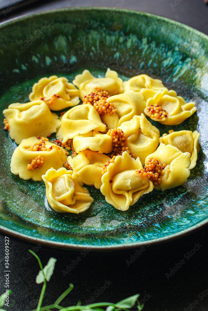 tortellini, pasta with filling (ravioli or dumplings) second course Menu concept. food background. top view copy space for text tortellini, pasta with filling (ravioli or dumplings) second course Menu concept. food background. top view copy space for text
