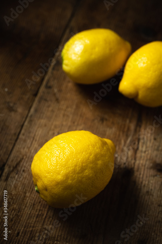 group of lemons on wooden table