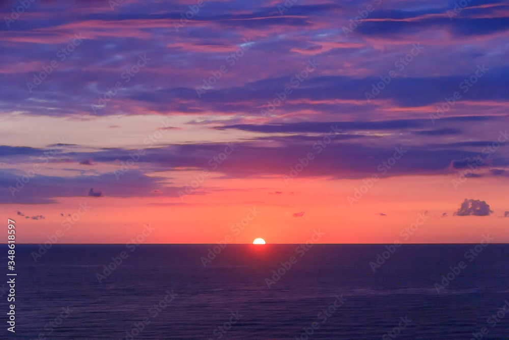 The sun sets over the horizon over the Black Sea in Batumi, Adjaria, Georgia. Relaxation and meditation, the concept of peace and silence. Design for postcard or calendar, place for text.