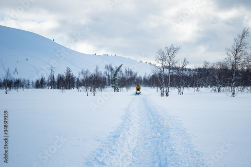 snowmobile in winter mountains