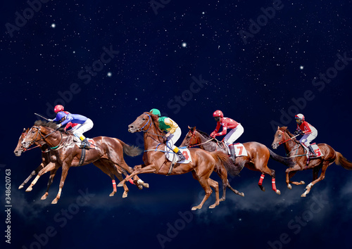 Four racing horses neck to neck in fierce competition for the finish line photo