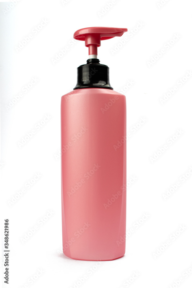 Mockup pink bottle for design. Pink container for cosmetics isolated on a white background. Beauty and health concept. Mockup pink bottle for design. Pink container for cosmetics isolated on a white background. Beauty and health concept.