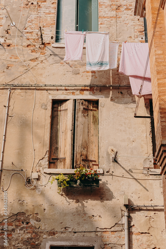 The beautiful, sunny streets of Venice, ancient buildings, canals and roofs The beautiful, sunny streets of Venice, ancient buildings, canals and roofs