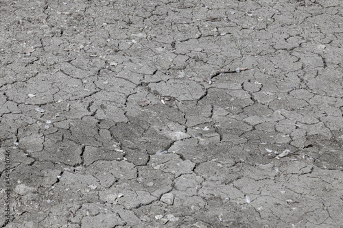 Vászonkép A close-up of cracked asphalt due to reconstruction and repair of the roadbed - the old layer is destroyed and a fresh layer will be laid in its place