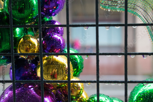 mardi gras ornaments in the rain