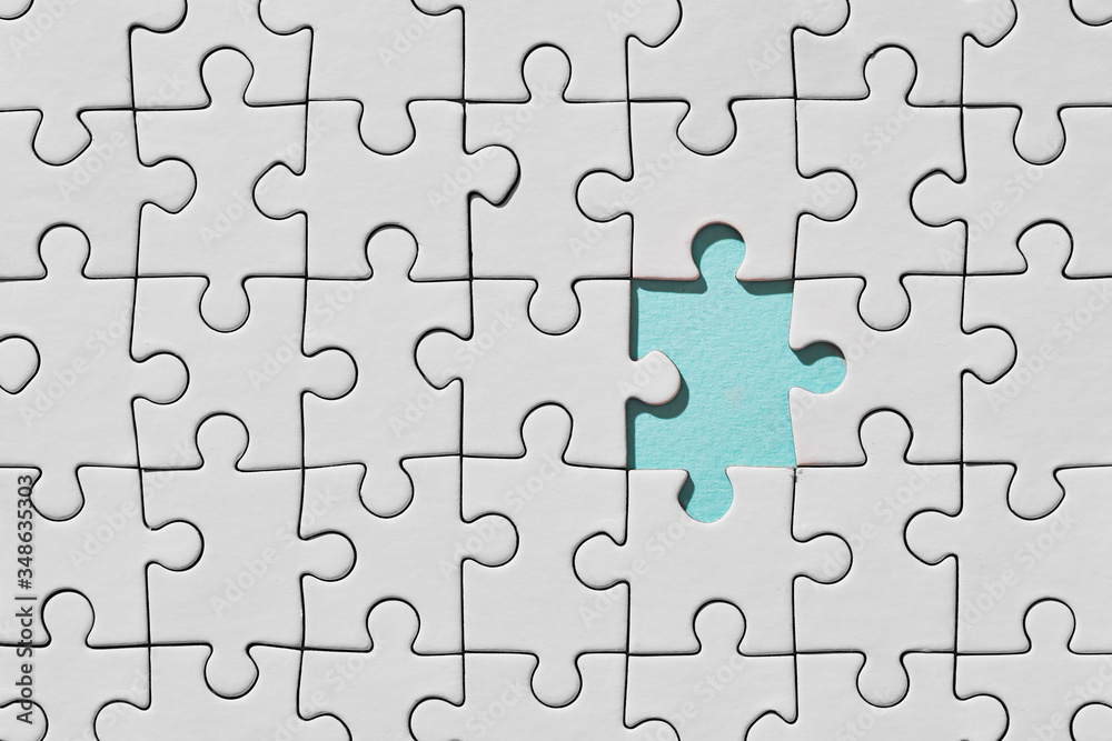 Background of white puzzle with missing piece Background of white puzzle with missing piece