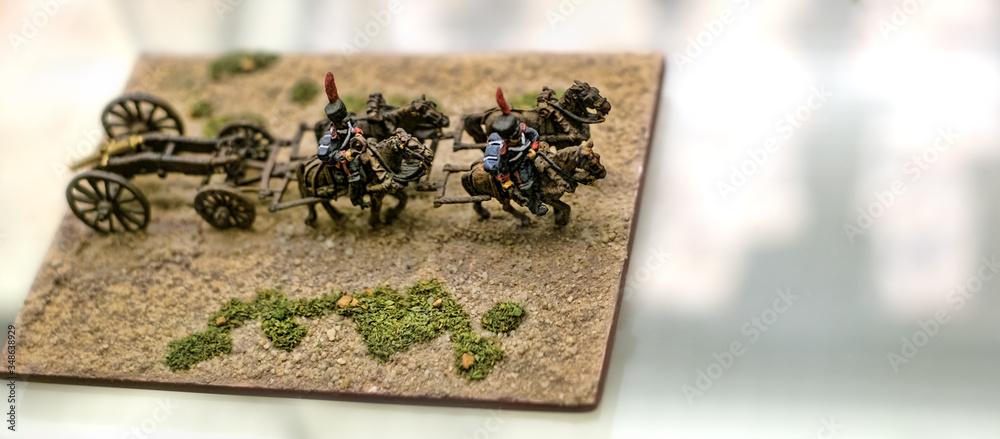 miniature toy soldiers on a cardboard