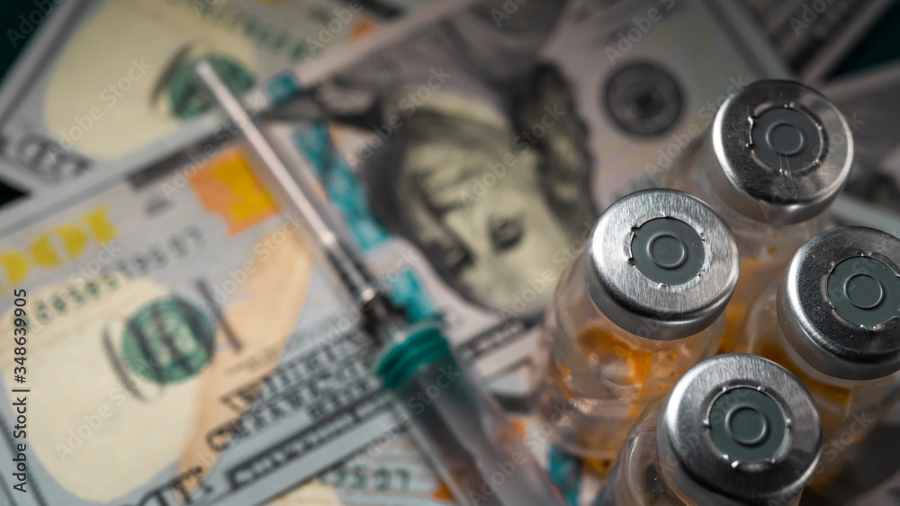 Buying and selling medicines.American hundred dollar bills and Russian currency,1000 rubles.Spending on expensive medicines and treatment in hospitals.The vials with the orange substance on the bills. Buying and selling medicines.American hundred dollar bills and Russian currency,1000 rubles.Spending on expensive medicines and treatment in hospitals.The vials with the orange substance on the bills.