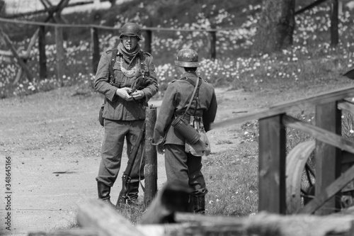 Black and white photography, reconstruction of a military battle World War II