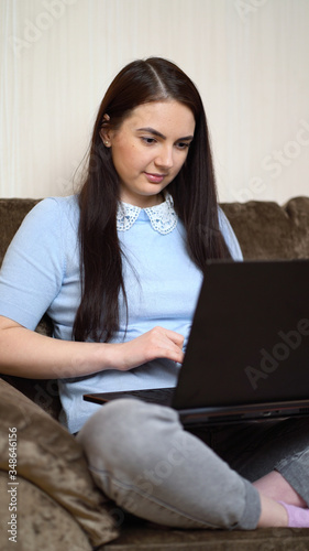 woman working on laptop computer at home office. © MrP