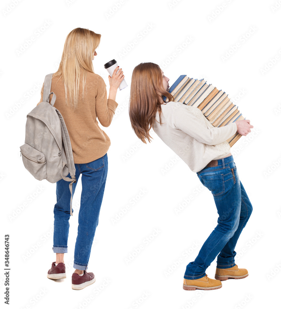 Back view of two woman in sweater.