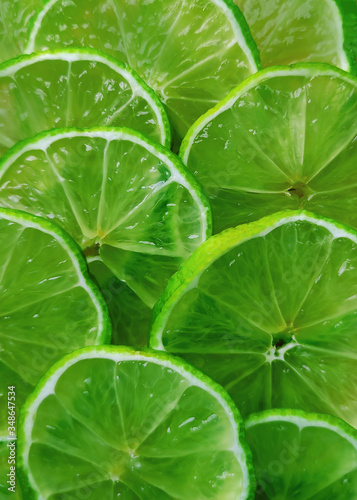 Background consisting of lime slices...