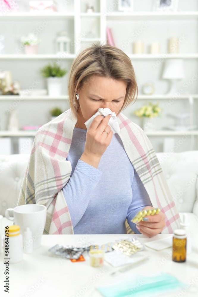 Portrait of beautiful young woman with pills