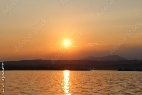 panorama of lake Garda at sunset in the fog © Anastasiia