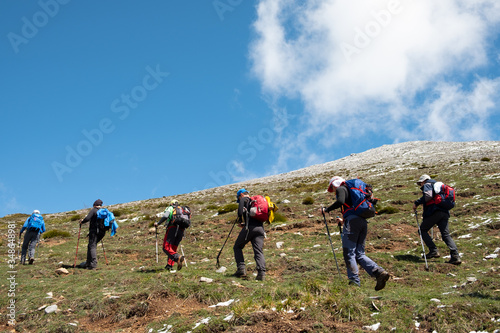 Grupo de senderistas realizando una excursión en el Parque Natural Montaña Palentina. photo