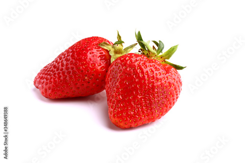 A pair of strawberries on white isolated background