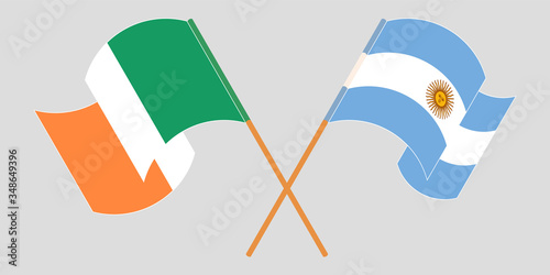 Crossed and waving flags of Ireland and Argentina