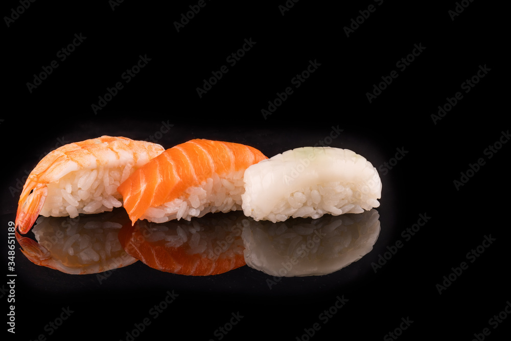 Simple sushi nigiri maki set isolated on black background. Various selection of traditional japanese Simple sushi nigiri maki set isolated on black background. Various selection of traditional japanese