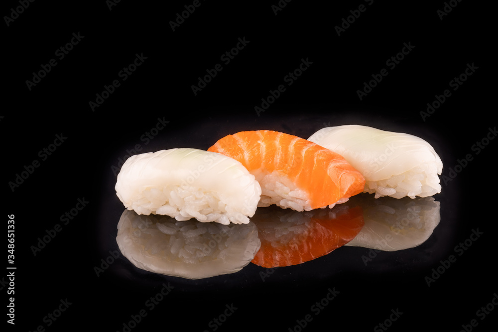 Simple sushi nigiri maki set isolated on black background. Various selection of traditional japanese Simple sushi nigiri maki set isolated on black background. Various selection of traditional japanese